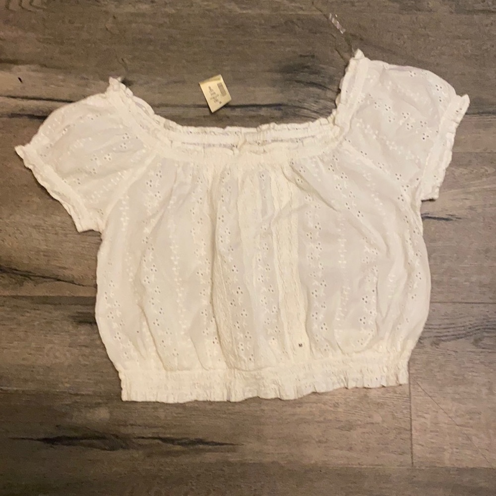 White ruffle crop top with embroidery designs